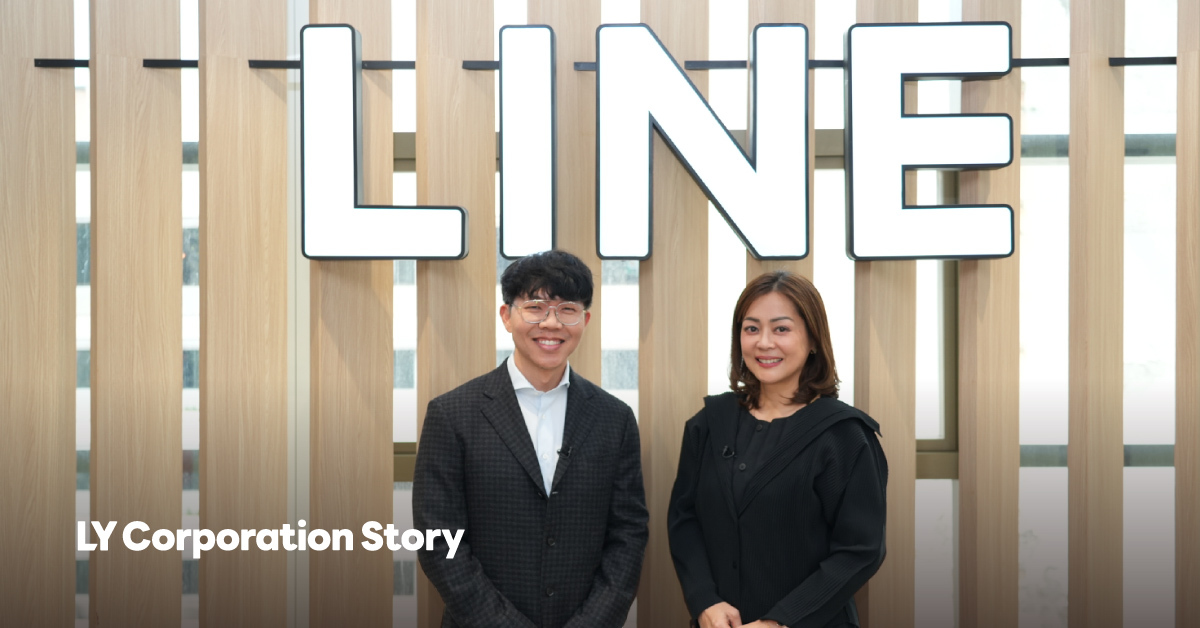 A photo of Nate (on the left) and Aey (on the right) standing side by side and facing forward.