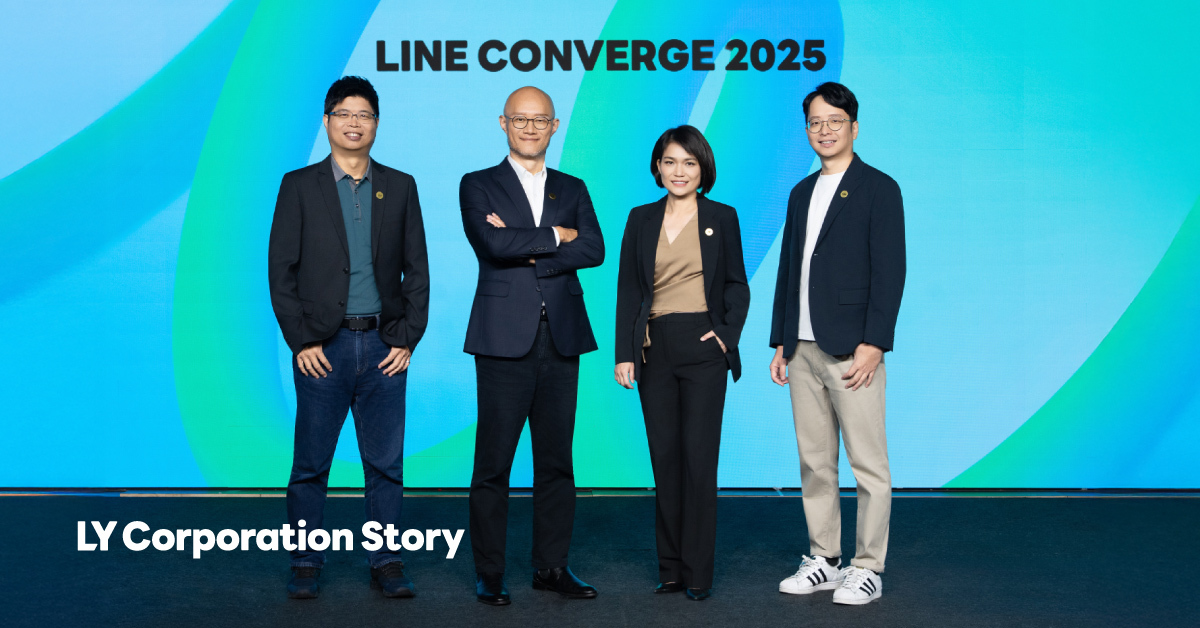 Marco, Roger, Janice, and Benny from LINE Taiwan standing on a stage with LINE CONVERGE written in the background.